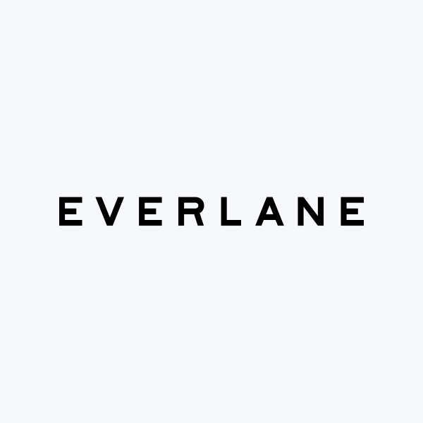 The image displays the word "EVERLANE" in bold black capital letters centered on a light gray background.